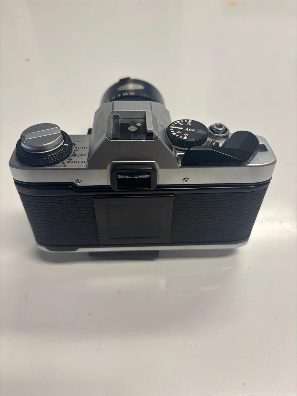 Olympus OM-G Film Camera + 135 mm lens.